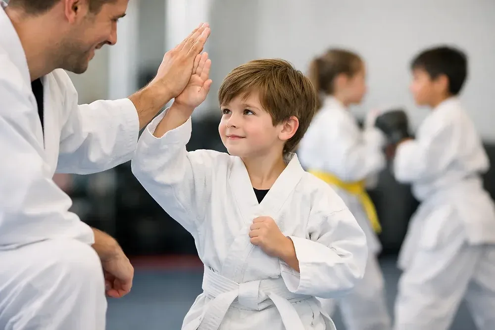 Child practicing martial arts in a supportive dojo environment