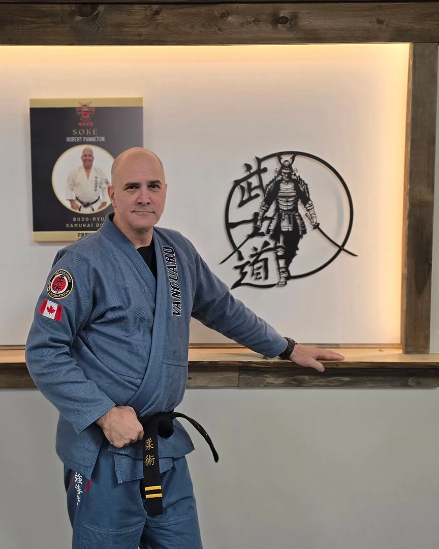 Renshi JP Perron in his blue Vanguard gi inside the Chesterville dojo